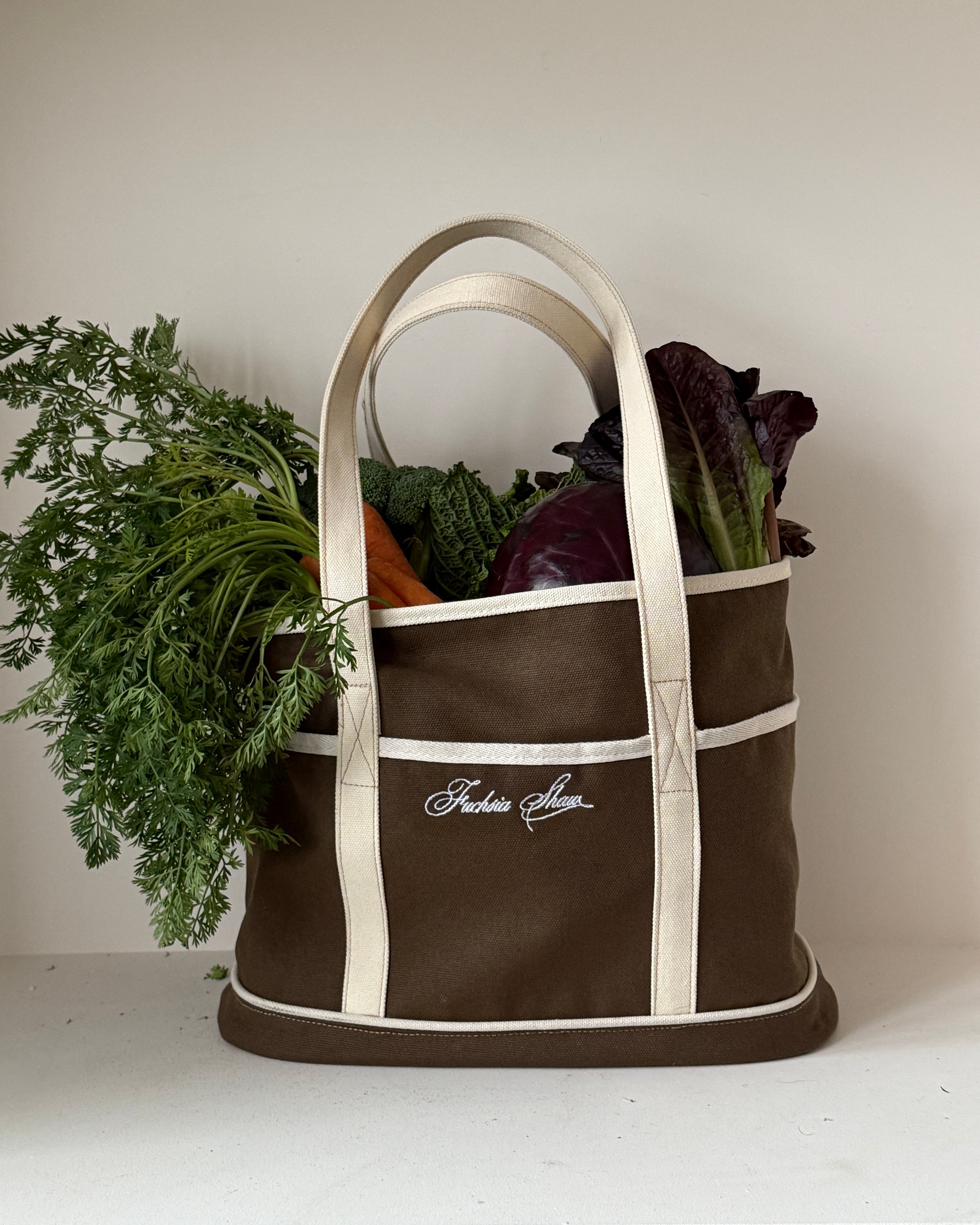 Brown and white tote bag with vegetables