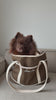 Video of a dog in a tote bag with embroidered "Fuchsia Shaw" barking 